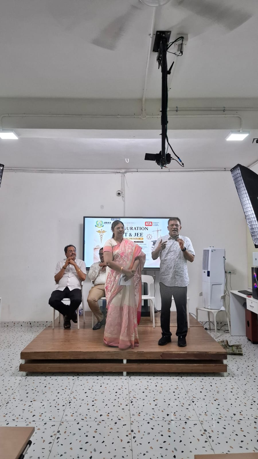 Program coordinators addressing the audience at the NEET and JEE coaching launch