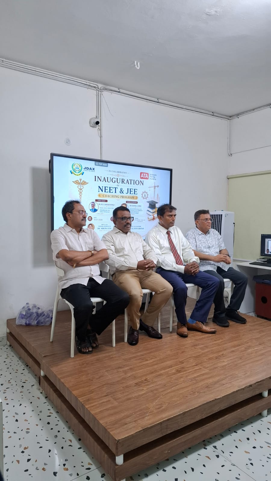 Dignitaries seated on stage at the inauguration of the ATA NEET & JEE Coaching Program